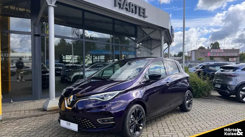 zu sehen ist ein lilafarbender Renault Twingo 