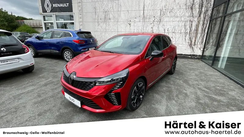 zu sehen ist ein roter Renault Clio 
